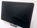 a tablet that is sitting on a stand on a table