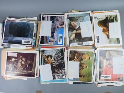 a lot of pictures hanging on the wall of a room