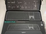 two laptop computers sitting on top of each other on a table