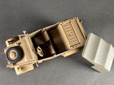 an overhead view of a toy army vehicle with a box on the back