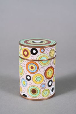 a small tin with a colorful design on it