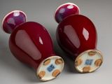two salt and pepper shakers sitting on a table