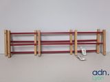 a close up of a rack with a remote control on it