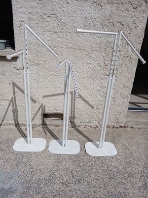 two white poles that are on the ground next to a building