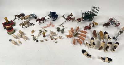 a lot of small toy animals and horses on the table
