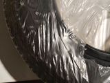 a tire that has been wrapped in plastic to protect it from the sun