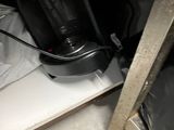 a coffee maker that is sitting on a shelf