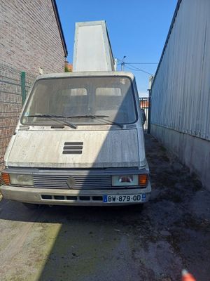 a white van that is parked on the side of the road