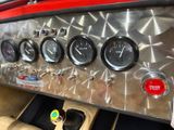 a close up of a dashboard of a car with gauges and gauges