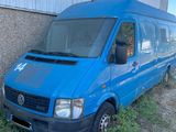 a blue van parked in front of a building
