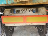 a close up of the back end of a truck with a license plate
