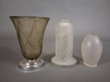 three vases sitting next to each other on a table