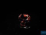 an orange diamond on a black background