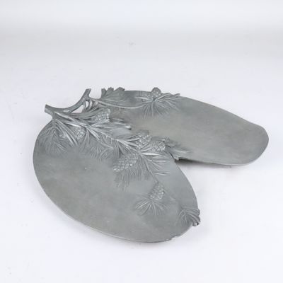 a pair of silver shoes that are on a white surface