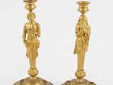 pair of antique brass candlesticks with figures on bases