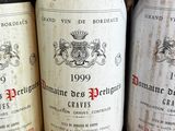 several bottles of wine are lined up on a table