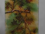 une photo d'un tableau représentant un arbre avec des feuilles