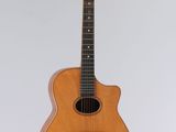 an acoustic guitar hanging on a wall with a white background