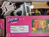 a cardboard box with some toys inside of it