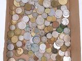 a box full of coins sitting on a table