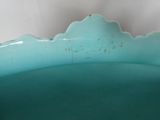 a blue bowl with a mountain design on it