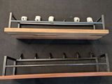 two shelves that are holding a pair of rollers