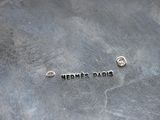 a silver plate with the word hermes paris written on it