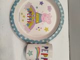 a picture of a plate and a cup on a table