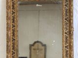 a mirror that is sitting on a white surface