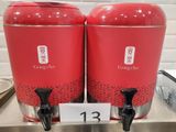 two red containers that are sitting on a counter