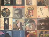 a lot of records on the floor of a room