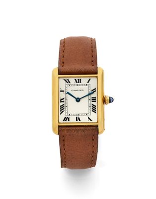 une montre Cartier en or jaune 18 carats avec des chiffres romains