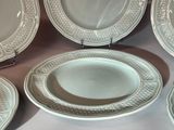 many plates that are sitting on a table
