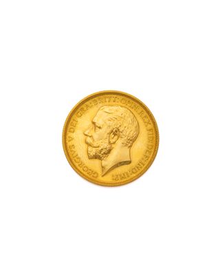gros plan d'une pièce d'or sur fond blanc