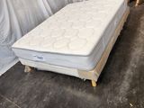 a mattress that is sitting on the floor in a room