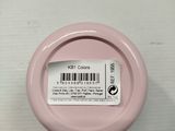 a close up of a pink container with a barcode on it