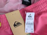the back of a pink jacket with a tag on it