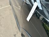 a car that has a sign attached to the side of it