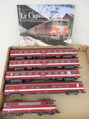 six red and white train cars in a box