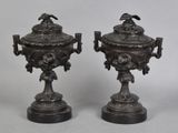 pair of antique bronze urns with birds and flowers on them