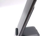 a cell phone that is sitting on top of a stand