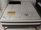 a mattress that is sitting on a table in a room