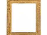 an old picture frame with a white background and a white wall