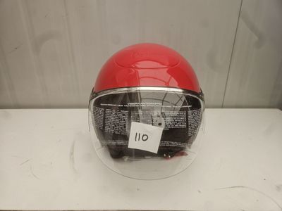 a helmet with a tag on it sitting on a table