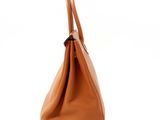 an image of a brown leather handbag on a white background