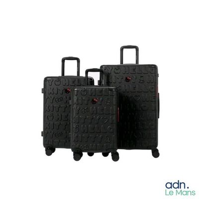 three pieces of luggage sitting on top of each other on a white surface
