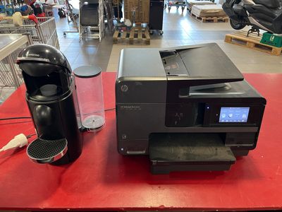 an image of a printer and a coffee maker on a table