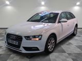 an image of a white audi car in a showroom