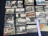 many old postcards on the table with pictures on them