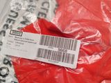 a red glove that has a price tag on it